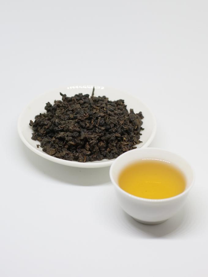 ばねの平らにされた緑の茶葉との有機性ウーロンの茶タイGuan Yin